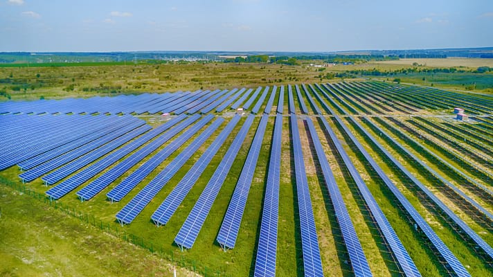 Solar power plant in the field. Aerial view of Solar panels. Solar farm. The source of ecological renewable energy.